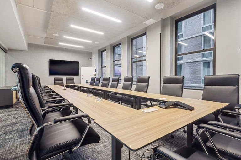 Meeting room with conference table and office chairs